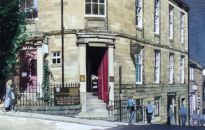 Saddler Street to the right of the painting at one time boasted a castelated gateways protecting the entrance to the Cathedral quarter, a remnant of which can be seen behind an obscure doorway off the main street.
